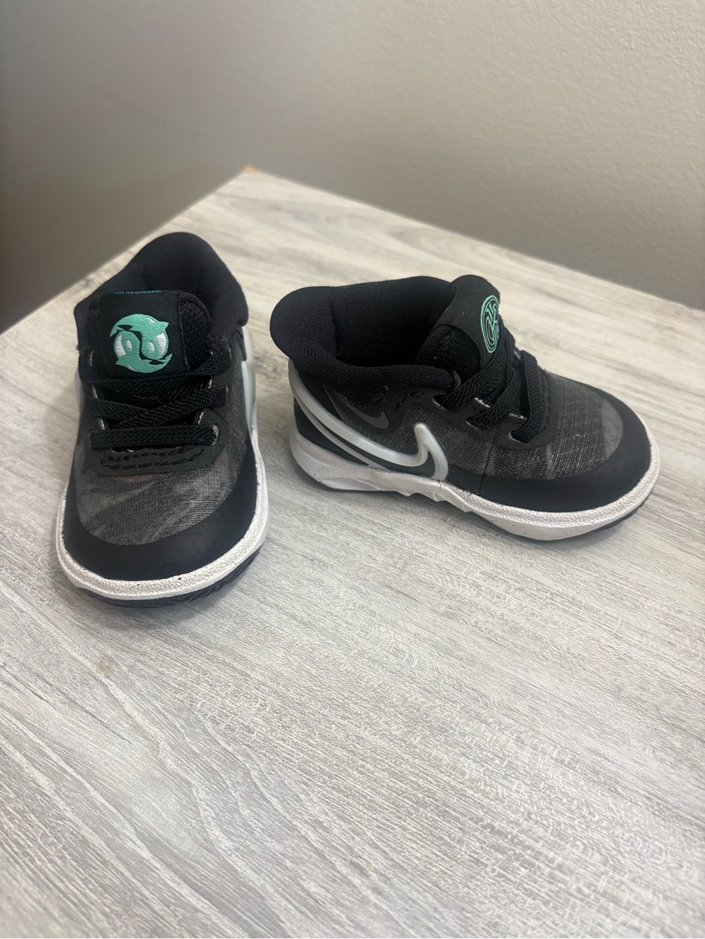 Nike Kids Black Sneakers with Teal Accents